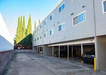 A parking garage with cars parked in it.